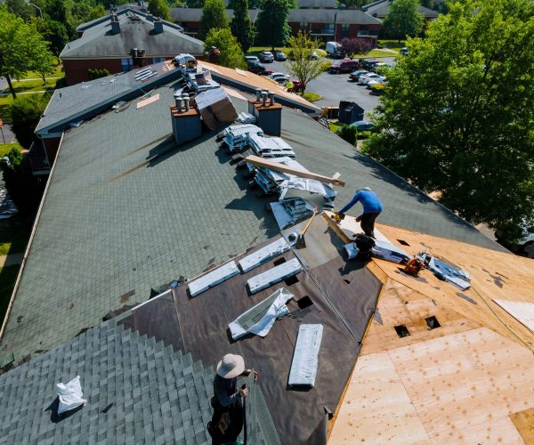 Construction worker on a renovation roof the house installed new shingles